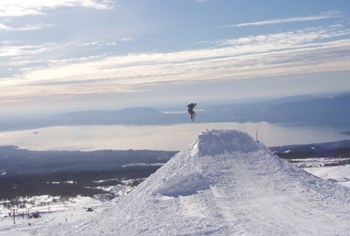 Taking some big air at Pucon resort, Lago Villarica in the background.