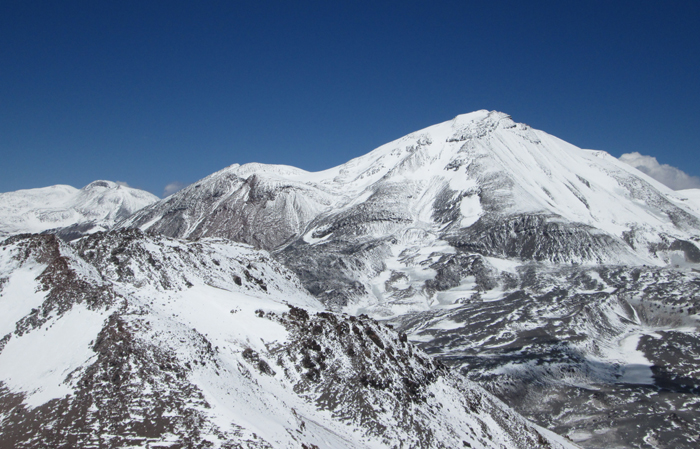 Ojos del Salado from high on El Muerto in snowy conditions. 