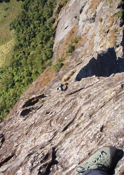 Looking down the easy but exposed top pitch of the Normal route on the Pedra da Bau. 