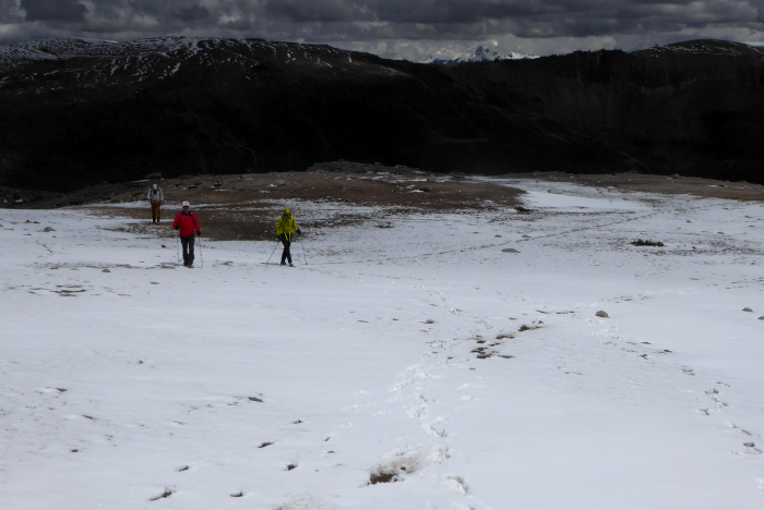 Heading towards the summit of Nevado Culi with an incoming storm. 