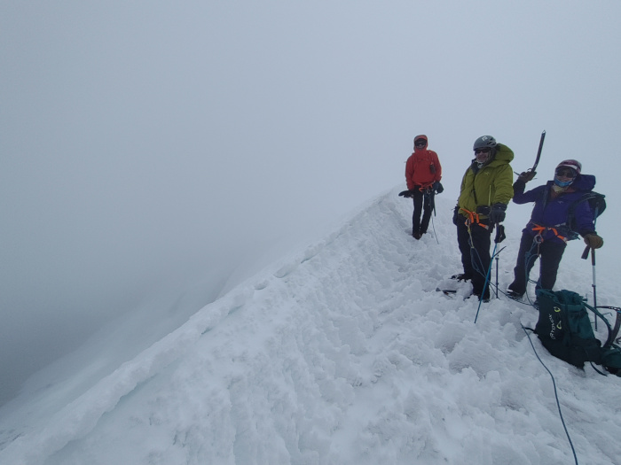 Standing on the summit of Jonorana, 5553m, Peru.  